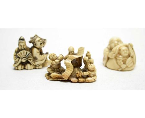 A 19th century carved ivory netsuke in the form of Shou Lao and Daikoku and young boy with rat and scroll, signed, 4.5cms; an