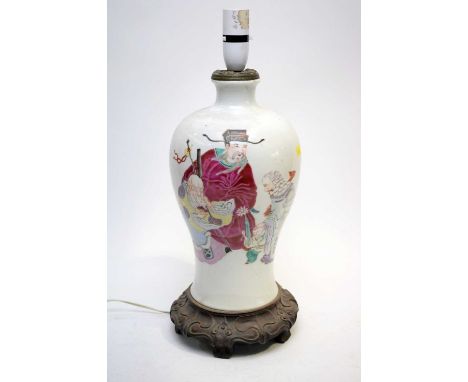 A Chinese Famille Rose vase, 19th century, of meiping form decorated with Shou Lao and two other Chinese immortals, with an a