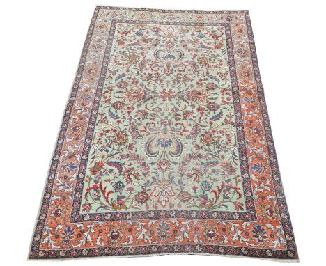 Antique Tabriz carpet, with floral scrolls on light green ground, 331 x 210cms.