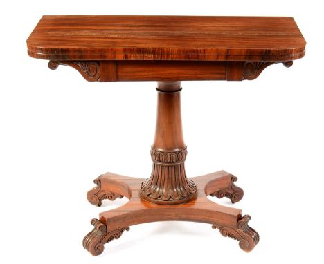 An early Victorian rosewood card table, the hinged swivel top opening to reveal a baize lined playing surface, on turned and 