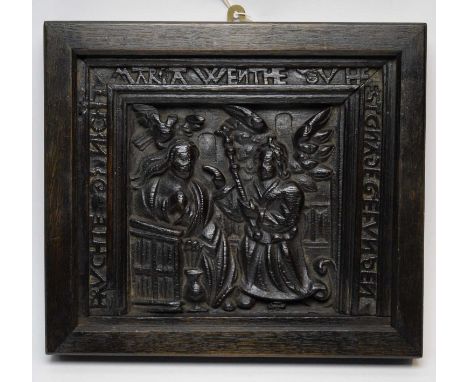 A German carved oak panel of the Annunciation, probably 18th Century, in later oak frame, 32.5 x 28.5cms. 