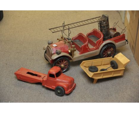 A large scratch built model of a pre war fire engine and a metal toy dumper truck