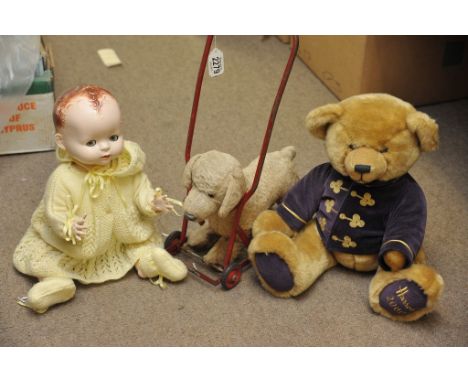 A 1950's Pedigree doll, Chiltern push along dog and Harrods bear