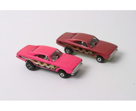 A Matchbox Superfast No.70 Dodge Dragster Pre Production in dark maroon with snake decals along both sides. Light green metal