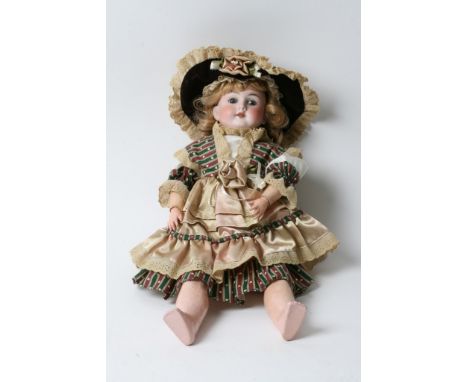 A German bisque headed doll by Max Handwerck having closing eyes and open mouth