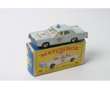 A Matchbox Pre Production Regular Wheels No. 55 Mercury Park Lane Police Car in pale duck egg blue having blue light, black w