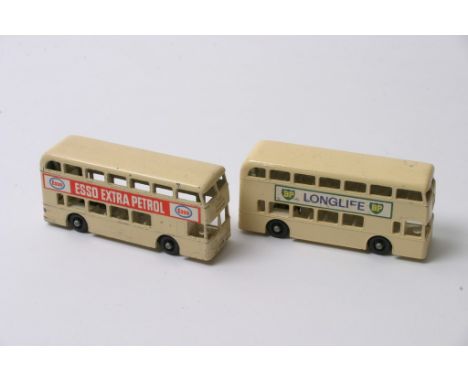 Two Matchbox Regular Wheels No 74 Daimler Buses in cream, one having BP Longlife decal the other Esso Extra Petrol 