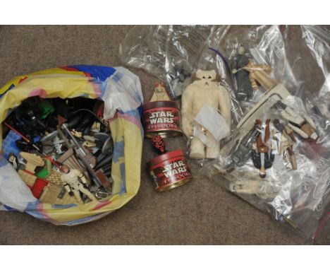 A collection of vintage Star Wars figures and a bag containing various other Star Wars memorabilia including lego figures. 