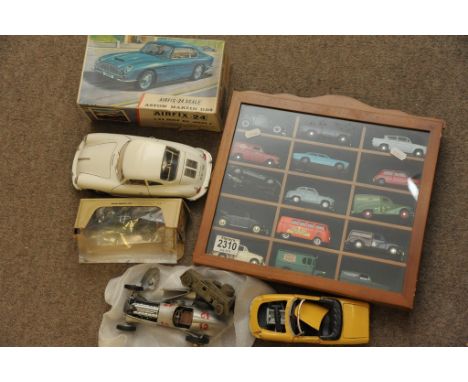 A display case containing Corgi Ford Escort Saloon, various Vanguards and Lledo, a boxed Airfix 24 1/24 scale Aston Martin DB