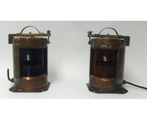 A pair of brass and copper ship starboard and port lamps, the handle stamped IP56, height 37cm also stamped NK77.