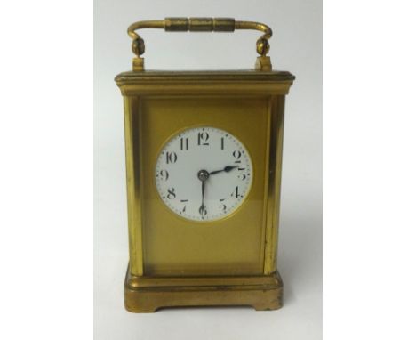 French brass case carriage clock, with gong strike, platform escapement circular dial with arabic numeral, height 12cm exclud