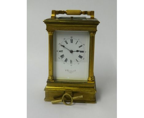 A heavy brass cased carriage clock, with platform escapement, striking on a gong with repeater movement, inscribed W.Marshall