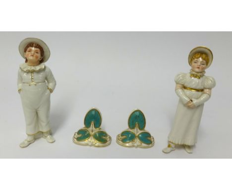Pair of Royal Worcester porcelain salt and pepper pots formed as young children also a pair of Davenport porcelain place sett