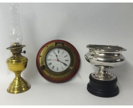 A modern marine wall clock, a brass oil lamp and a good quality silver plated rose bowl on stand (3).