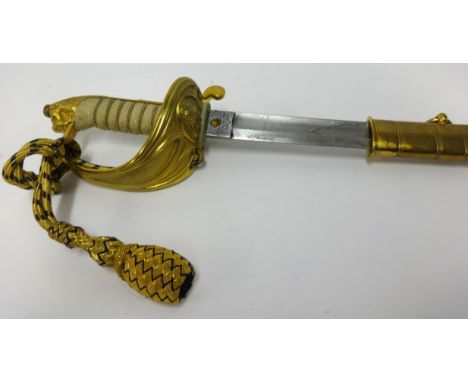 A George V Royal naval officer’s dress sword, the etched blade with foul anchor and G.R.V cypher, inscribed H.Shannon and Son