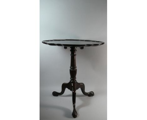 A Mahogany Piecrust Snap Top Tripod Table on Claw and Ball Feet. 60cms Diameter