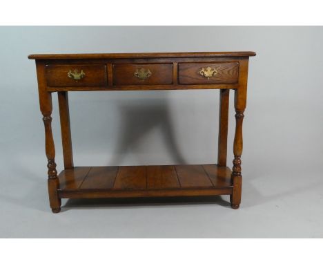 A Modern Oak Narrow Hall Table with Three Drawers and Pot Board Shelf, 99cm Wide