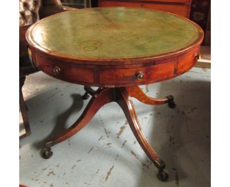 DRUM TABLE, Regency mahogany, the tooled inlaid green leather top with frieze drawers on a turned column and tripod supports,
