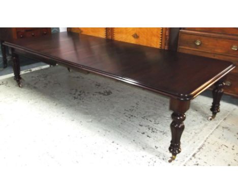 DINING TABLE, Victorian and later mahogany with three extra leaves on lobed legs with brass caps and ceramic castors, 74cm H 