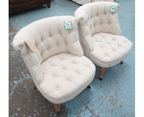 BEDROOM CHAIRS, a pair, in neutral fabric button back on turned castor supports, 57cm W. (2)