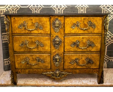 COMMODE, 92cm H x 125cm x 55cm, Régence style burr walnut and gilt metal mounted with black marble top above six drawers. 