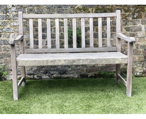 GARDEN BENCH, weathered teak of slatted form, 122cm W. 