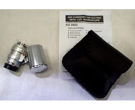 Cased 60x magnification currency/jewellery loupe with LED light. P&amp;P Group 1 (£14+VAT for the first lot and £1+VAT for su