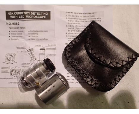 Cased 60 x magnification currency/jewellery loupe with LED light, batteries and instructions. P&amp;P Group 1 (£14+VAT for th