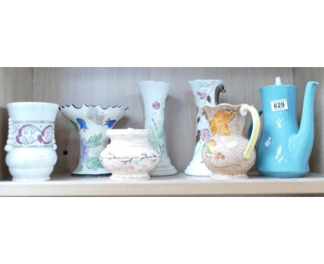 A mixed collection of ceramic items to include Art Deco hand decorated E. Radford water jugs, Arthur Wood decorative vases et