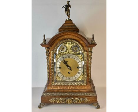 An early 20th Century oak and gilt metal mounted fusee bracket clock, 56cms h 