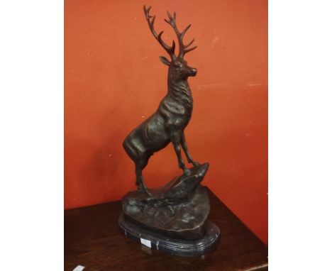 A large French style bronze figure of a stag, on black marble socle 