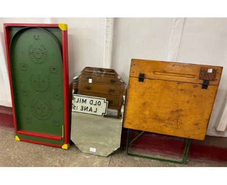 A child's folding desk, a bagatelle board and a bevelled edge mirror 