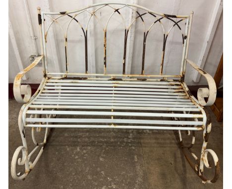 A painted metal rocking garden bench 