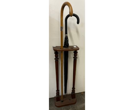 An early 20th Century mahogany stick stand 