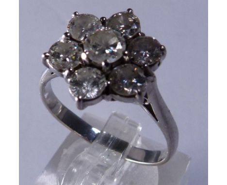 18 CT GOLD CLUSTER RING. 18 ct white gold seven diamond flower cluster ring, size R, 1,75 ct diamonds, 4,4g