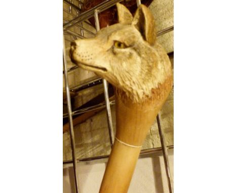 WALKING STICK. Hand carved wooden wolf handled walking stickL: 100 cm