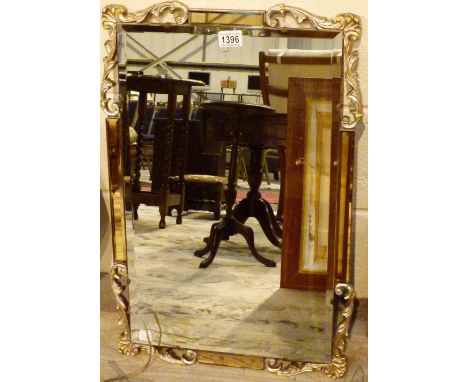 ART DECO MIRROR. Art Deco style mirror with bevelled edge and gilt scrolls