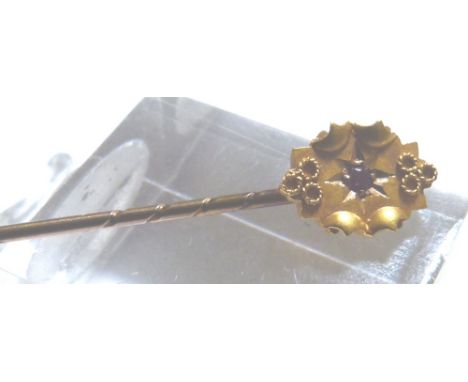 15 CT RUBY STICKPIN. 15 ct gold ruby set stickpin with hollow metal shank