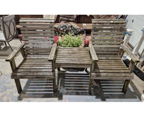 Two teak garden seats&nbsp;with fitted table between as a tete-a-tete bench&nbsp;