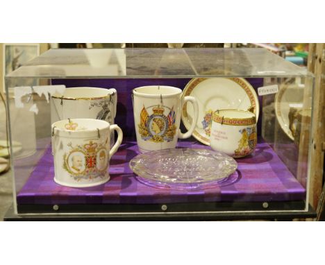 Four royal commemorative mugs, Victoria, Elizabeth II, George V and George VI and Elizabeth II glass plaque and&nbsp;a 'Poor 