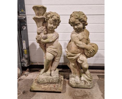 Two reconstituted garden figures&nbsp;in the form of cupid, one holding a torch, the other cymbals, tallest 70cm (2)&nbsp;