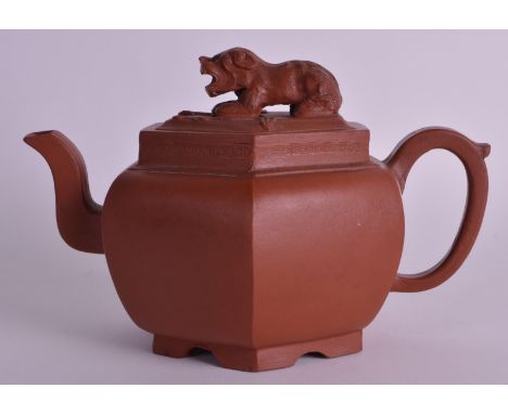 A GOOD 18TH CENTURY CHINESE YIXING POTTERY TEAPOT AND COVER Kangxi/Yongzheng, of hexagonal form, with buddhistic lion finial.