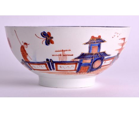 AN 18TH CENTURY VAUXHALL PORCELAIN BOWL painted with a man walking upon a bridge, decorated in imari tones. 6ins diameter.