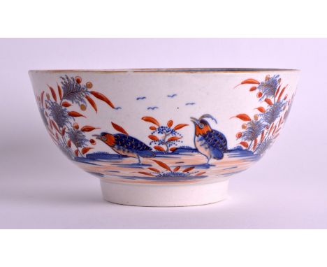 AN 18TH CENTURY WORCESTER PORCELAIN BOWL painted with two birds within a landscape, decorated in imari tones. 6.25ins diamete
