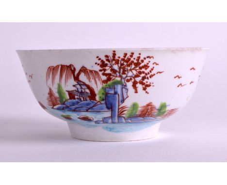 A MID 18TH CENTURY WORCESTER PORCELAIN BOWL painted with a fenced garden and a lakeland landscape. 4.25ins diameter.