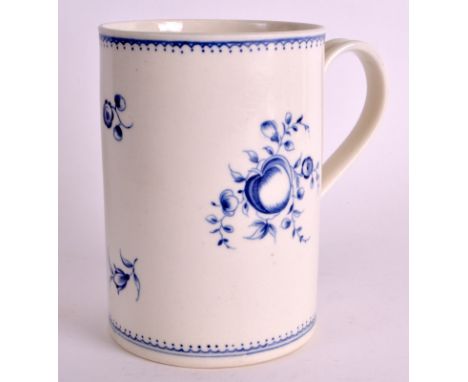 AN 18TH CENTURY WORCESTER MUG of large proportions, painted with scattered fruit. 6.25ins high. 