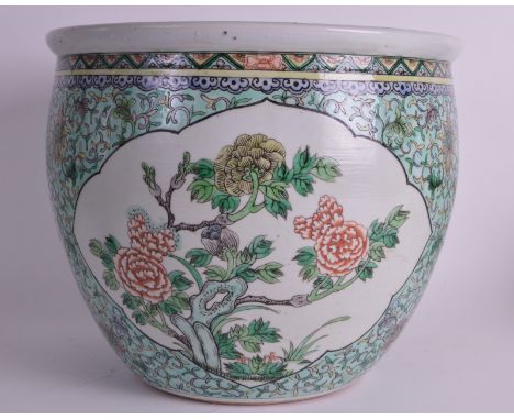 A 19TH CENTURY CHINESE FAMILLE VERTE JARDINIERE Kangxi style painted with floral sprays and motifs. 1ft diameter.