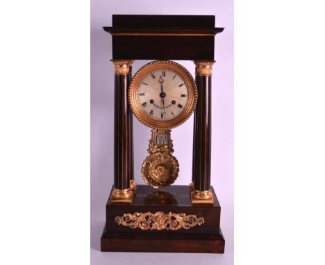 A LOVELY ROSEWOOD AND ORMOLU MANTEL CLOCK with central silvered dial engraved L'oiseau A Rochefort, with four cylindrical sup