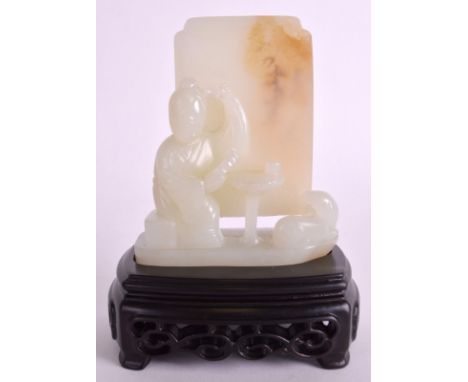 A CHINESE CARVED HETIAN JADE FIGURE OF A SEATED FEMALE probably late Qing, modelled seated beside a low table with a hound. 3