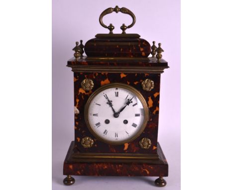 A REGENCY TORTOISESHELL AND BRASS MANTEL CLOCK with circular dial encased with floral roundels. 1ft 3ins high including handl